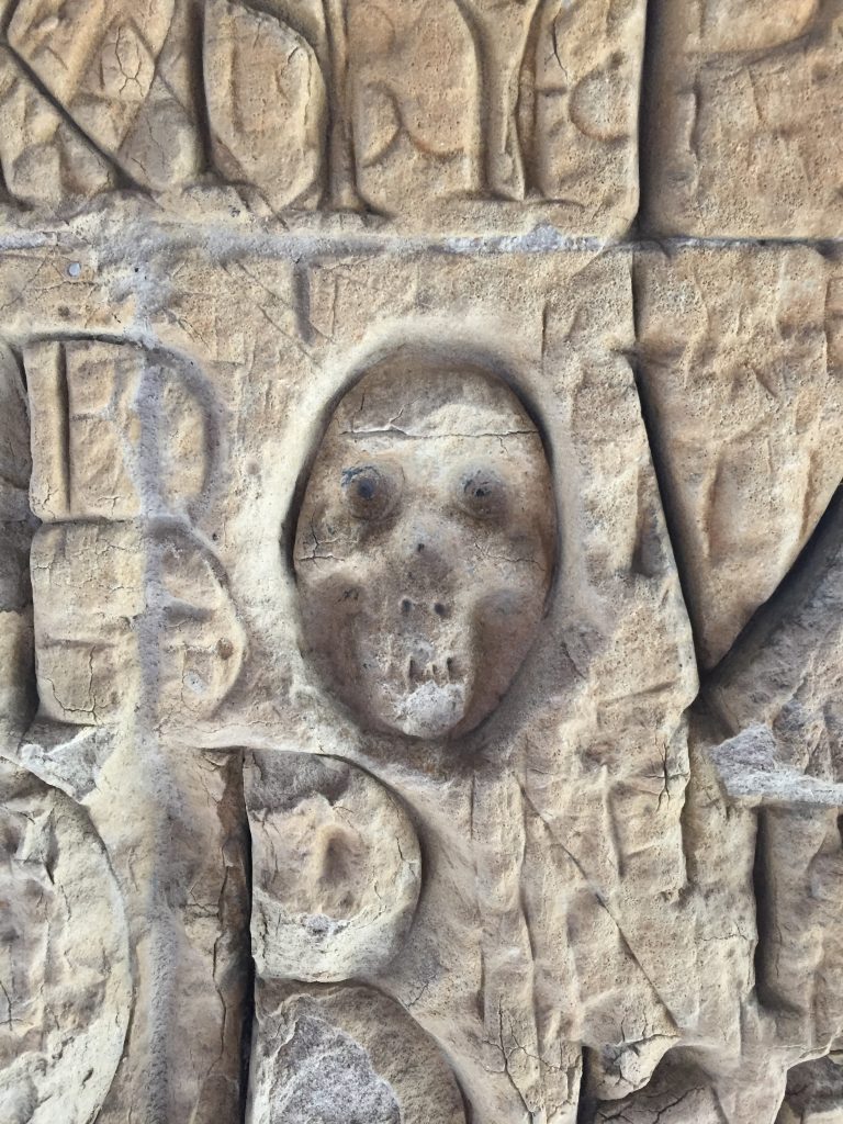 Memento mori skull 'graffiti' in the cloister, Eton College. Photography by the author