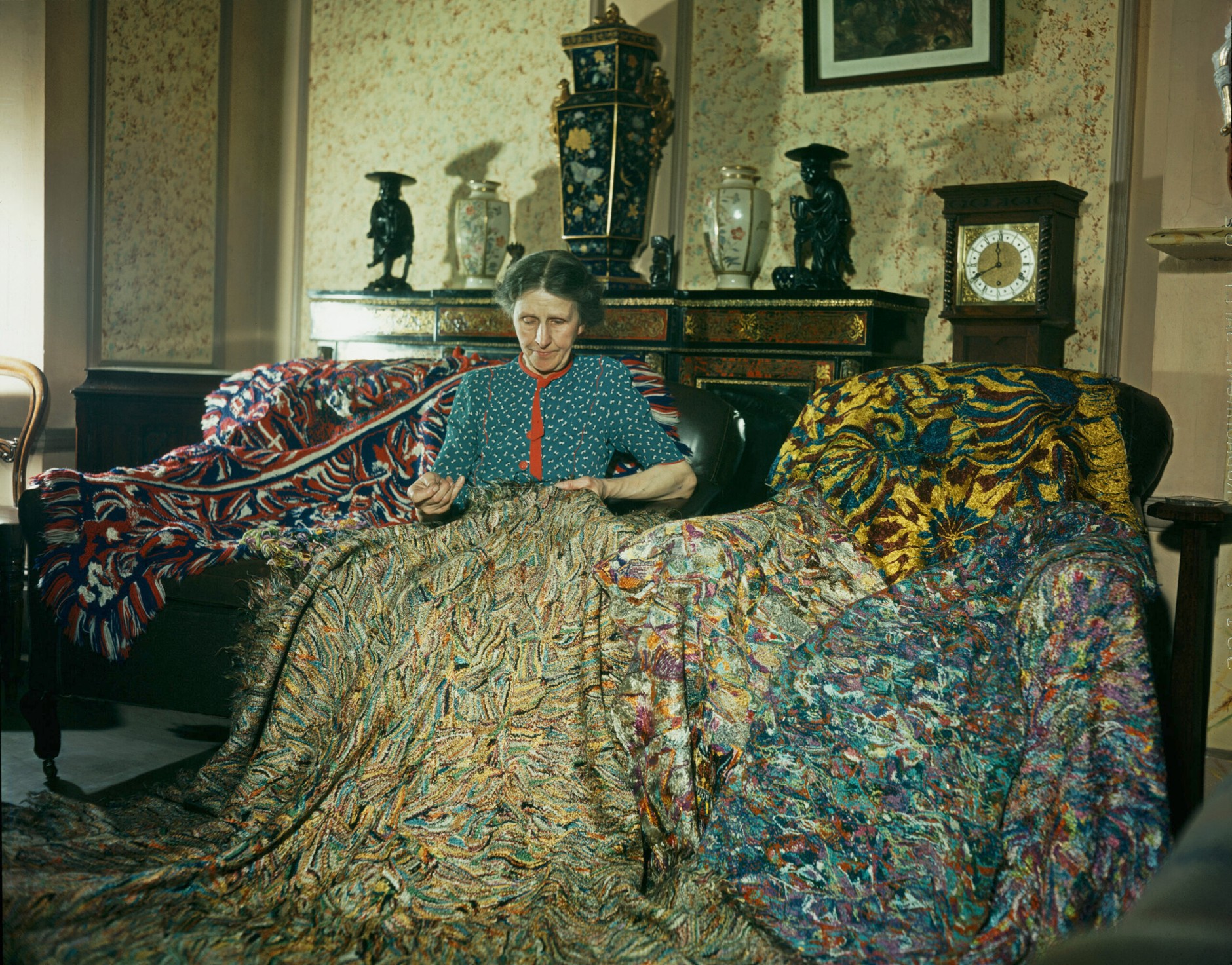 Madge Gill (Maude Ethel Eades, 1882-1961) making a rug by inserting leftover strands of silk into canvas backing, 19 August 1947. Photo by Paul Popper/Popperfoto via Getty Images.
